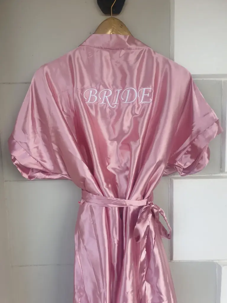 Blush pink satin gowns with white embroidery