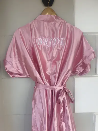 Blush pink satin gowns with white embroidery